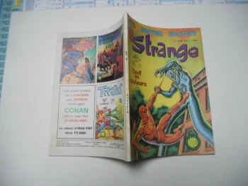 strange N° 98  avec poster attaché lug TBE